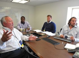 group of people around conference table
