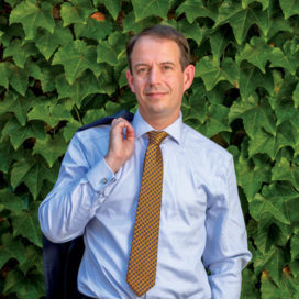 Dean Martijn Cremers with his suit jacket thrown over his shoulder