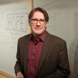 Tim Gilbride in front of a whiteboard