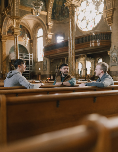 hallow app founders talk in a church