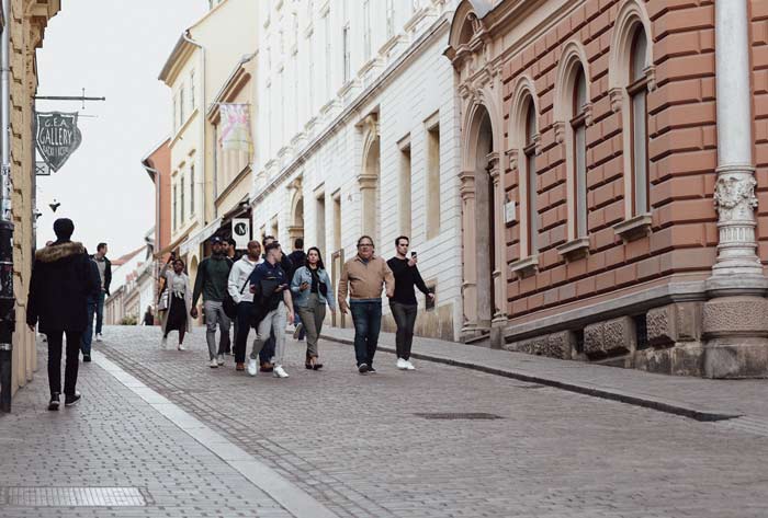 a group walking down a street in Croatia