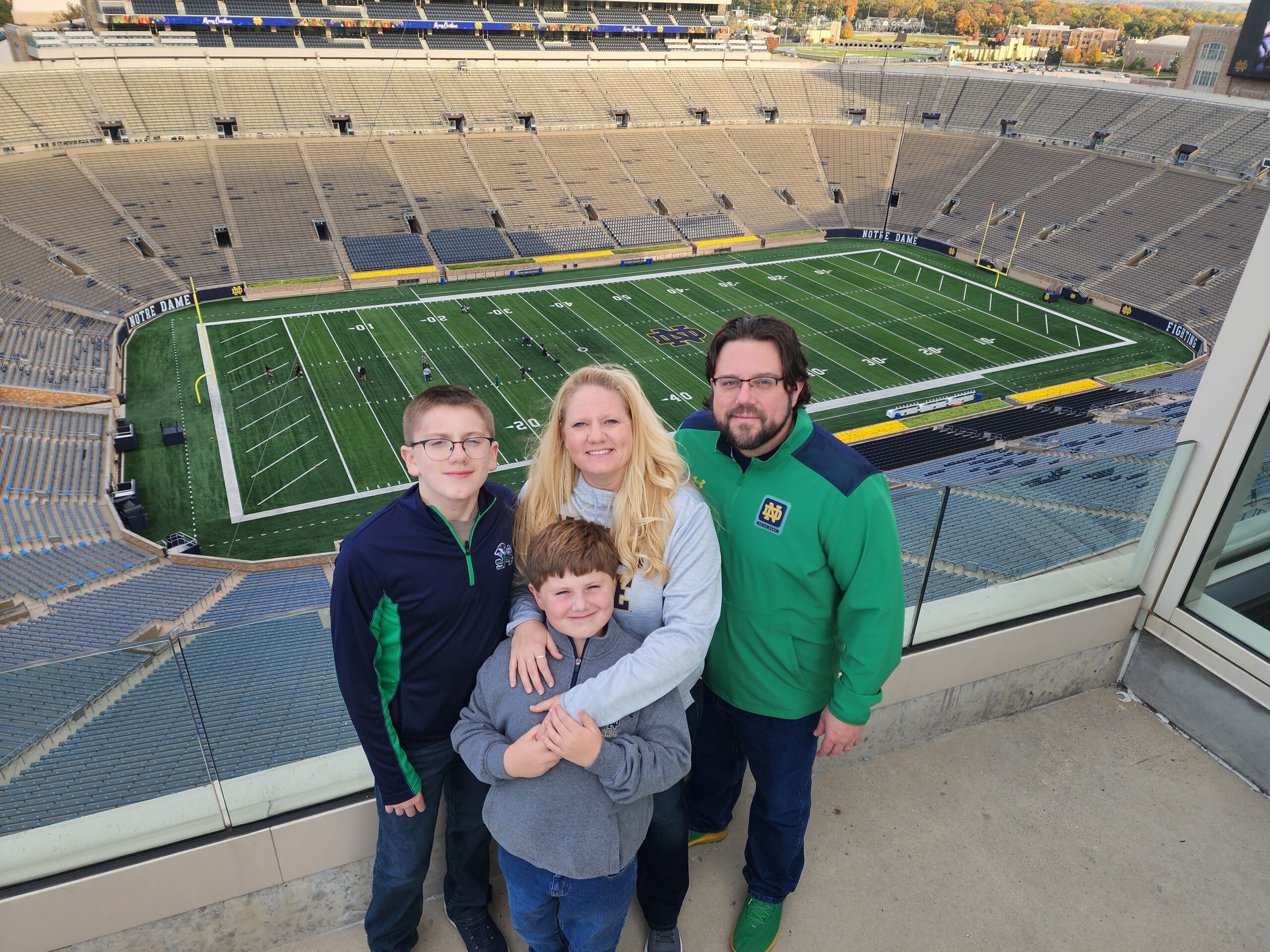 EMNA student Jen Armson-Dyer with her family in front of the Notre Dame stadium. 