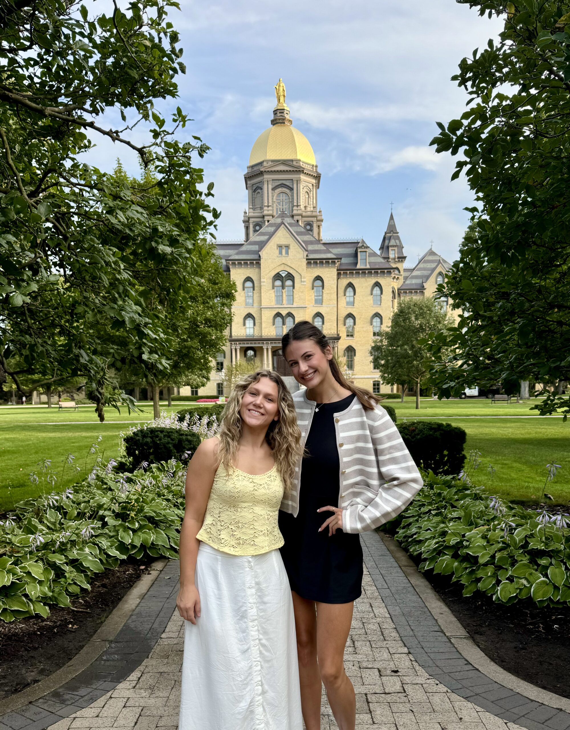 Lauren Tarnoff and a friend stand in front of Notre Dame's Main Building. 