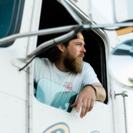 Ben Moore leans out of the window of his semi and looks into the distance.