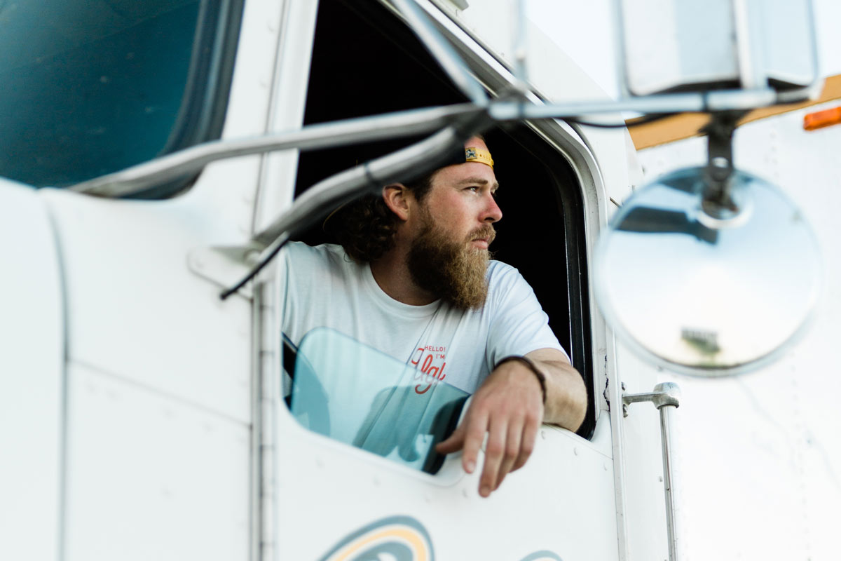 Ben Moore leans out of the window of his semi and looks into the distance.