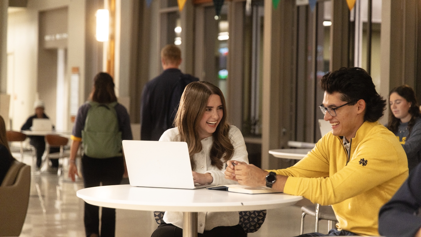 Students collaborating in Mendoza Atrium